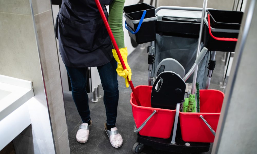 Woman cleaning at shopping mall. Cleaning concept.